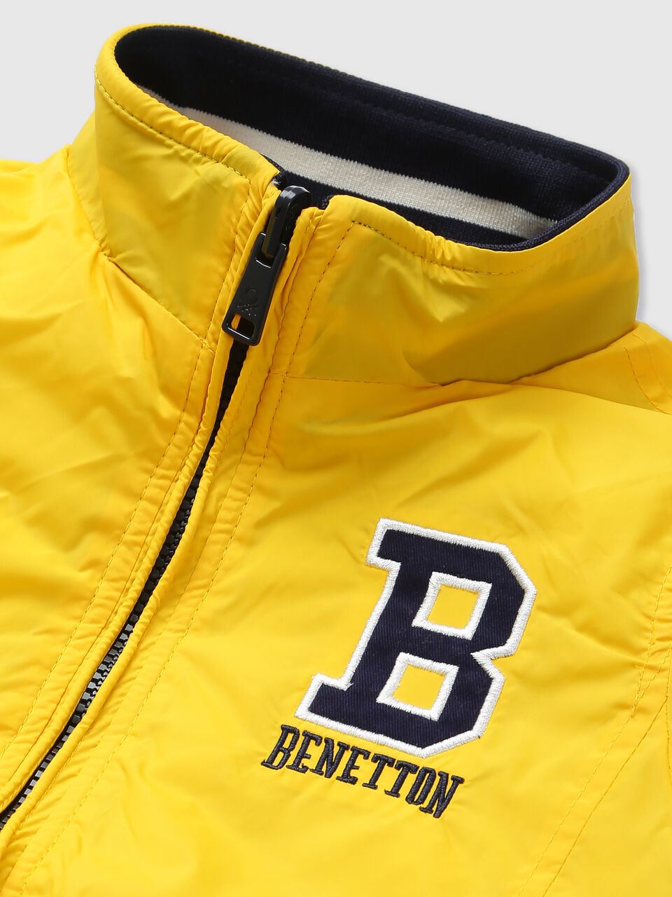 REVERSIBLE JACKET WITH AOP AND BADGE image number null