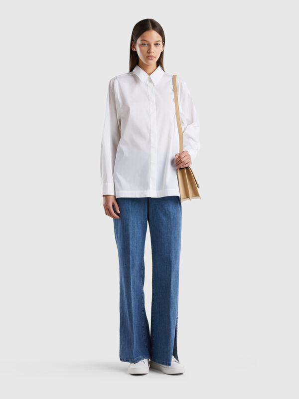 Flared jeans with slits