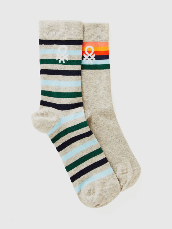 Two pairs of long socks with logos