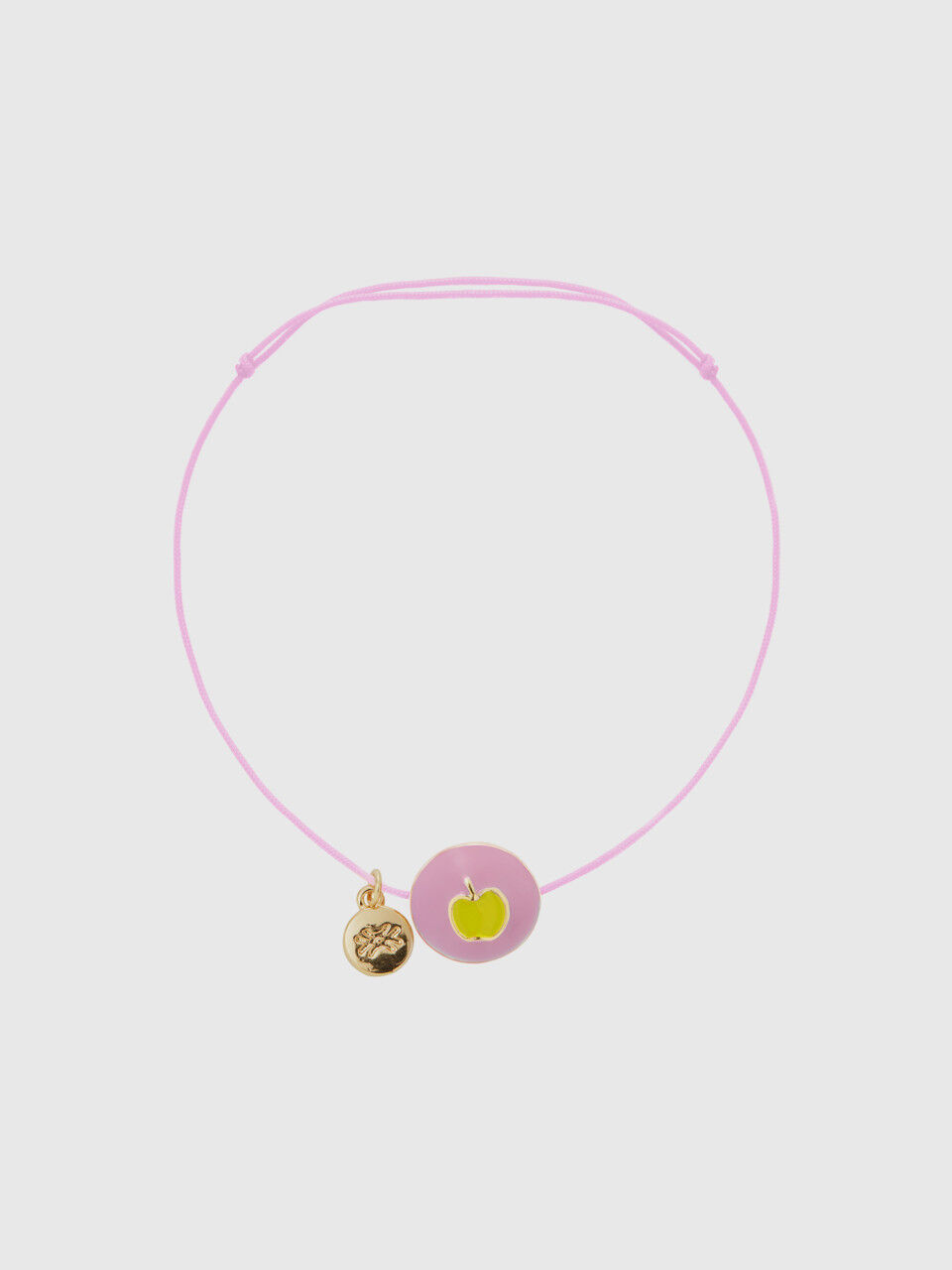 Pink bracelet with apple pendant