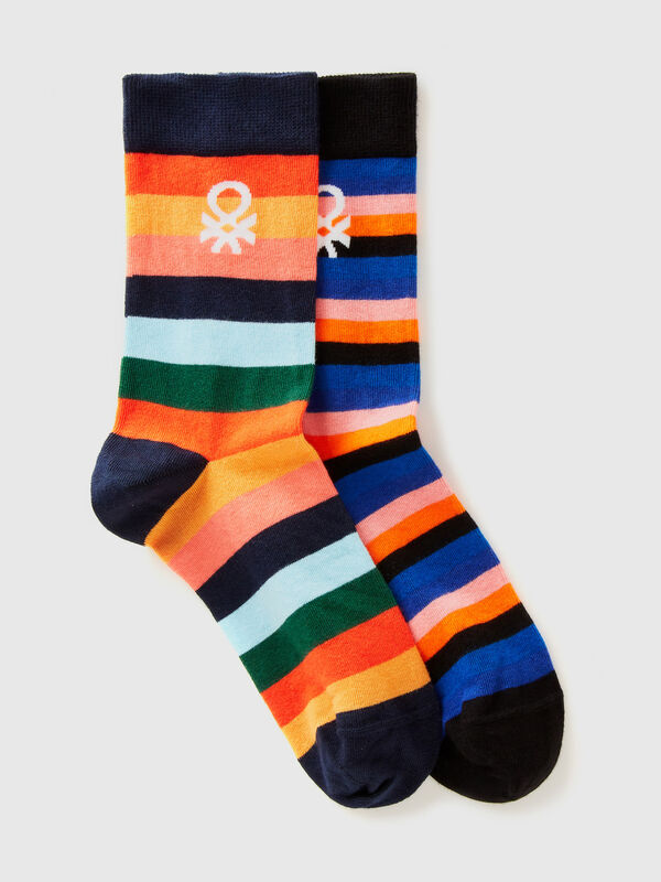 Two pairs of long socks with logos